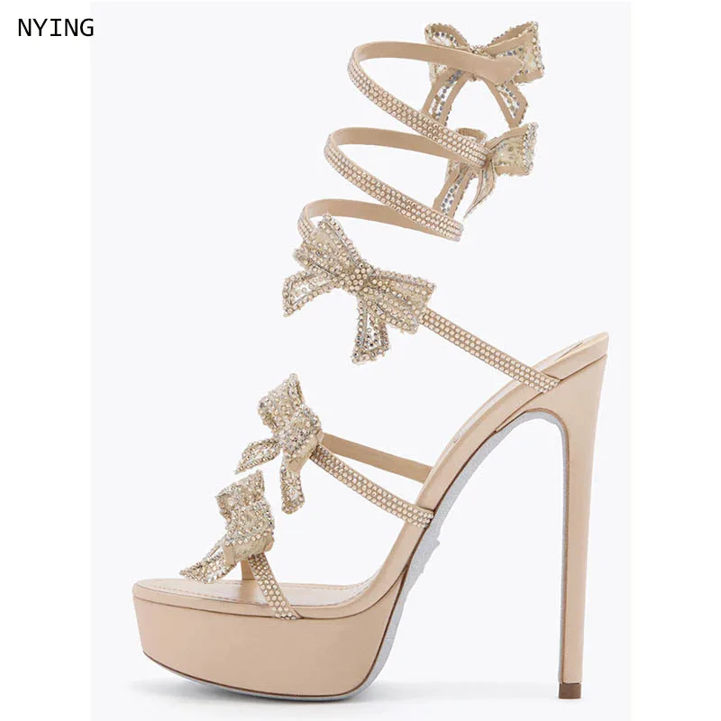 Women Nude Rhinestone Bow Wrap Around Ankle Strap Open Toe Platform Stiletto Heel Sandals, Crystal Embellished High Heels 44
Women Nude Rhinestone Bow Wrap Around Ankle Strap Open Toe Platform Stiletto Heel Sandals, Crystal Embellished High Heels 44