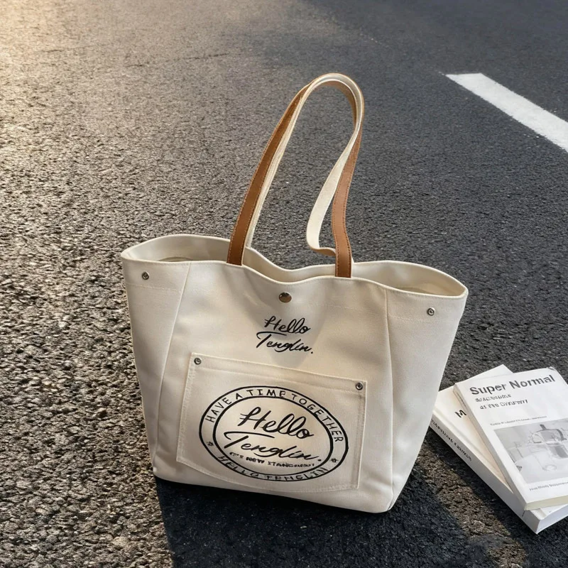 Fashion Korean Style Large Capacity Canvas Top Handle Bag Texture Simple Shoulder Bag for Women with Letter Print Storage Bags
Fashion Korean Style Large Capacity Canvas Top Handle Bag Texture Simple Shoulder Bag for Women with Letter Print Storage Bags