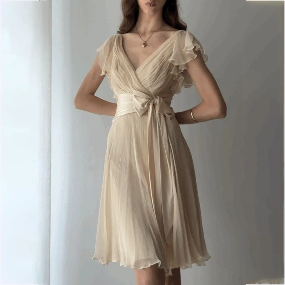 Classic V Neck Evening Dresses Short Sleeves Pleat Summer Beach Prom Dress With Bow Knee Length Flowing Graceful Party Gown 
Classic V Neck Evening Dresses Short Sleeves Pleat Summer Beach Prom Dress With Bow Knee Length Flowing Graceful Party Gown