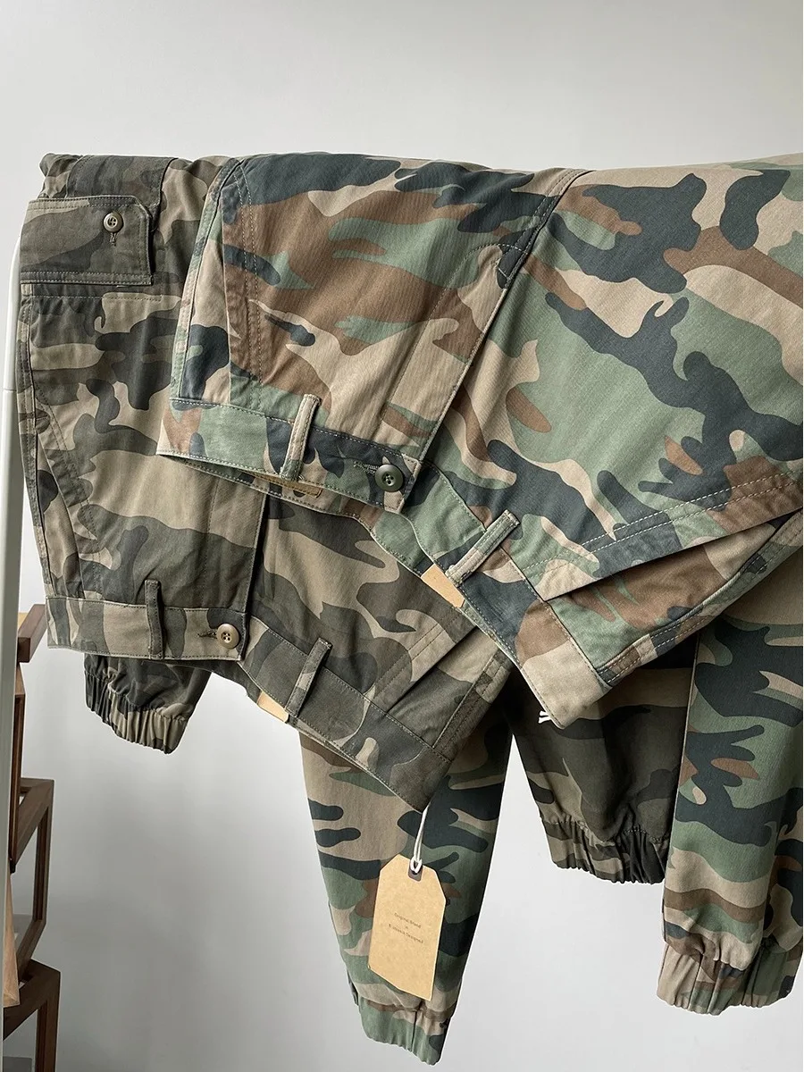 Брюки для рабочей одежды American Sle, мужские камуфляжные брюки с завязками, осенние новые ретро японские брендовые брюки с несколькими карманами и манжетами
Брюки для рабочей одежды American Sle, мужские камуфляжные брюки с завязками, осенние новые ретро японские брендовые брюки с несколькими карманами и манжетами