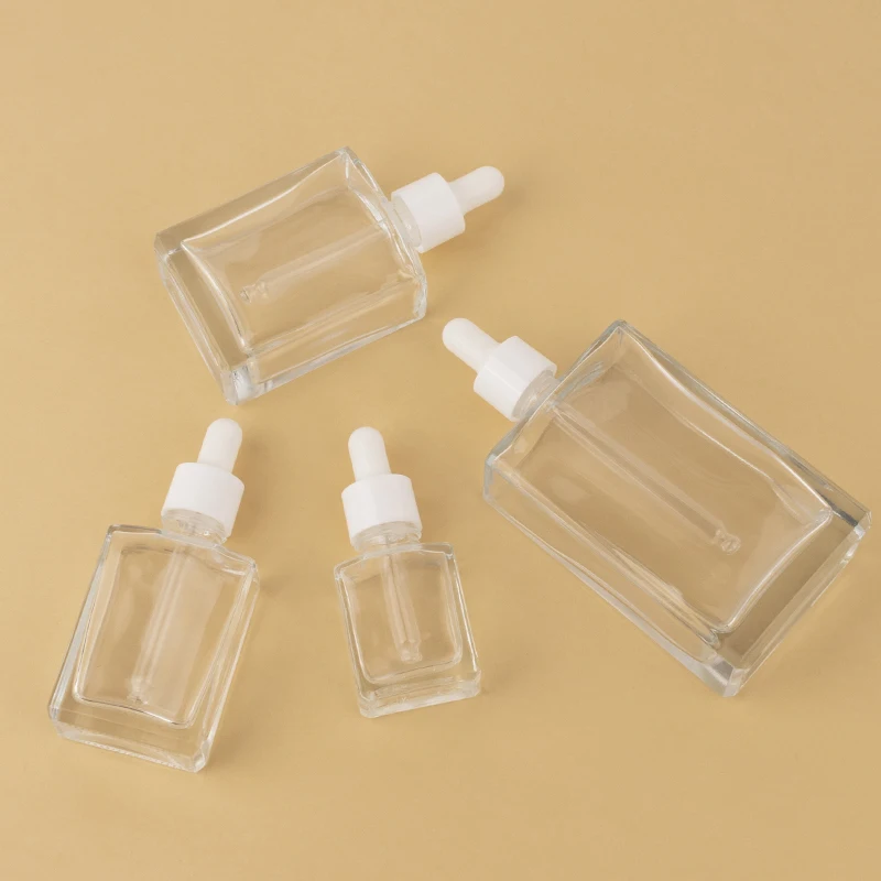 Clear rectangle Glass Bottles with bamboo square Glass Dropper Flat square Glass Dropper Bottle With White Plastic Rubber Head
Clear rectangle Glass Bottles with bamboo square Glass Dropper Flat square Glass Dropper Bottle With White Plastic Rubber Head