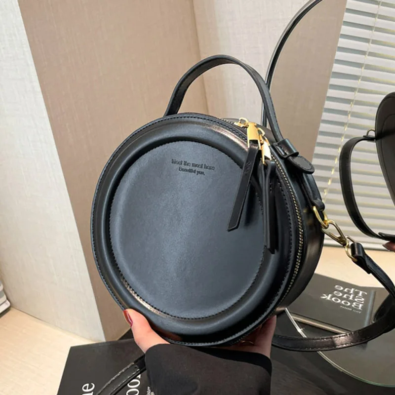 Новинка 2025, уникальная круглая сумка для женщин, модная сумка через плечо с круглой ручкой сверху, шикарная минималистичная сумка через плечо, универсальный день
Новинка 2025, уникальная круглая сумка для женщин, модная сумка через плечо с круглой ручкой сверху, шикарная минималистичная сумка через плечо, универсальный день