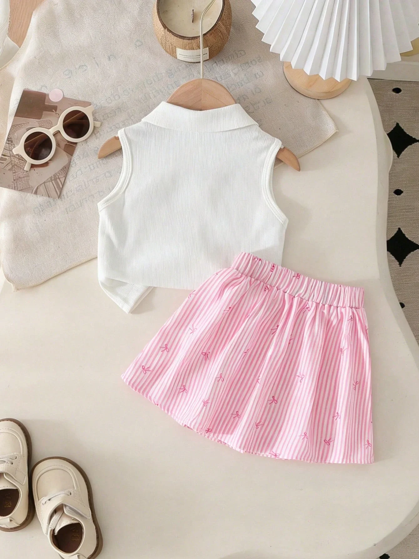 Women 2 Piece Set: White Ribbed Knit Sleeveless Top With Bow + Pink Striped Pleated Skirt
Women 2 Piece Set: White Ribbed Knit Sleeveless Top With Bow + Pink Striped Pleated Skirt