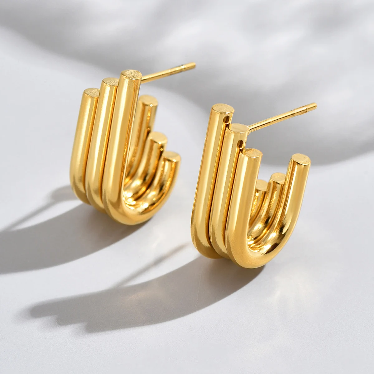 E77 Versatile Minimalist Hoops - Gold-Plated Stainless Steel Earrings Highlighting Rhythmic Cylinder Layers
E77 Versatile Minimalist Hoops - Gold-Plated Stainless Steel Earrings Highlighting Rhythmic Cylinder Layers