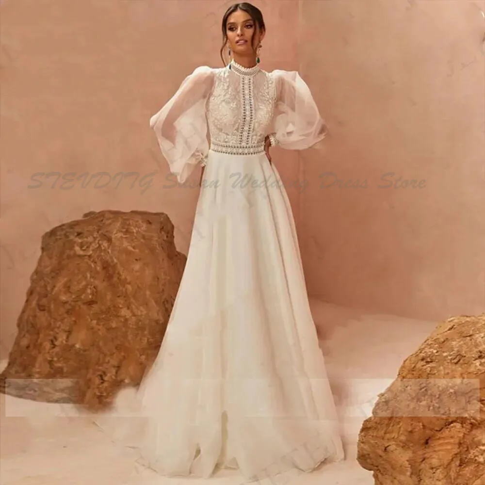 Элегантные свадебные платья Boho Vestidos De Boda 2025 с длинными пышными рукавами, трапециевидные платья невесты с высоким воротом и кружевной аппликацией, свадебный тюль
Элегантные свадебные платья Boho Vestidos De Boda 2025 с длинными пышными рукавами, трапециевидные платья невесты с высоким воротом и кружевной аппликацией, свадебный тюль