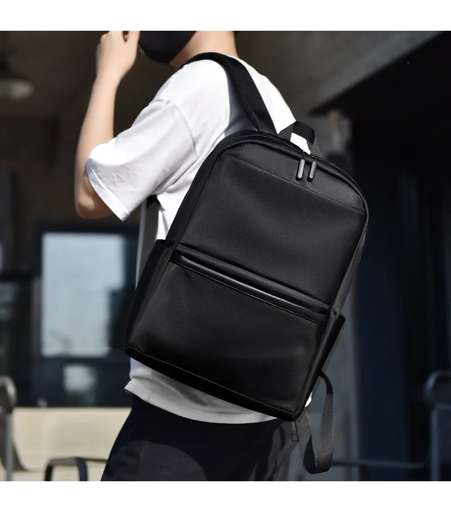 Solid black sleek waterproof backpack double metal zipper pulls two layered front pockets dual side slip pockets lightweight
Solid black sleek waterproof backpack double metal zipper pulls two layered front pockets dual side slip pockets lightweight