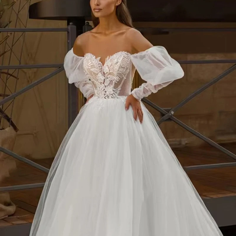 Elegant White Tulle Wedding Dress with Lace Appliqués Off the Shoulder Puff Sleeve Bridal Dress Long Train Wedding Gown
Elegant White Tulle Wedding Dress with Lace Appliqués Off the Shoulder Puff Sleeve Bridal Dress Long Train Wedding Gown