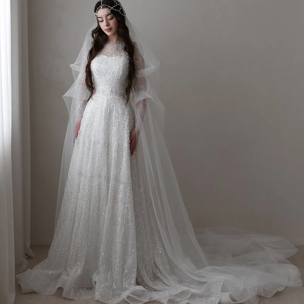 Роскошное свадебное платье с круглым вырезом и длинными прозрачными рукавами, платье принцессы невесты с бисером, церковное гражданское свадебное платье по индивидуальному заказу robe de mariée
Роскошное свадебное платье с круглым вырезом и длинными прозрачными рукавами, платье принцессы невесты с бисером, церковное гражданское свадебное платье по индивидуальному заказу robe de mariée