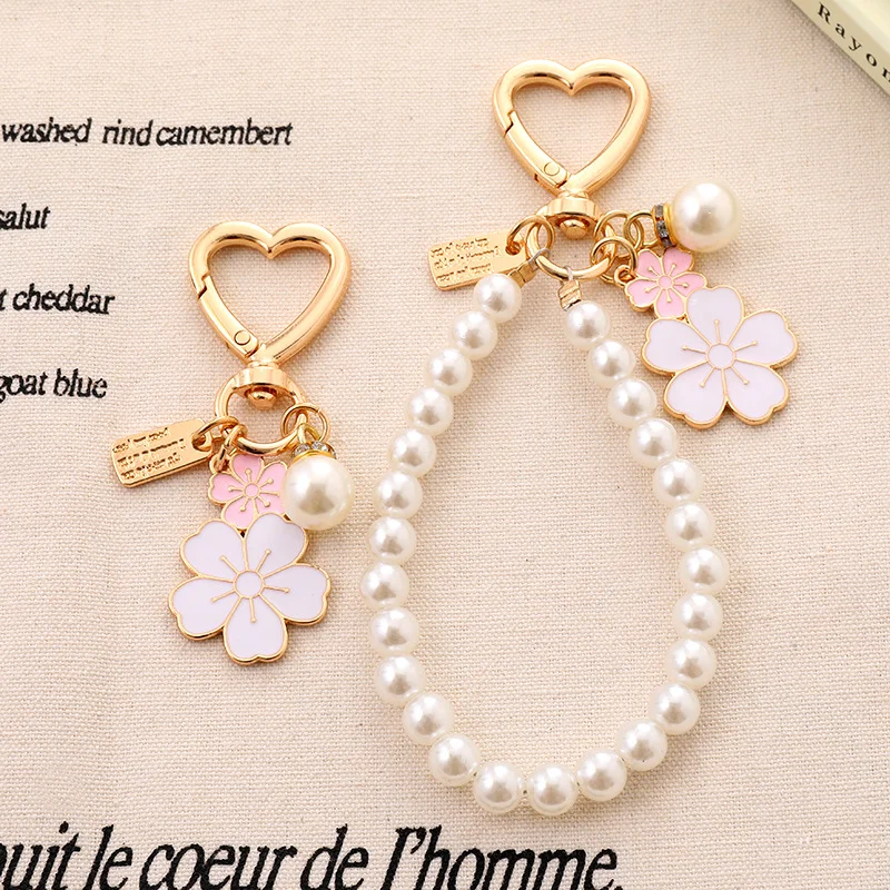 Pearl Phone Charm Wrist Strap with Heart Keychain and Flower Pendant, Cute Beaded Phone Lanyard for Women, Fashion Wrist Chain for Phone Case, Keys, Bag and Daily Accessories
Pearl Phone Charm Wrist Strap with Heart Keychain and Flower Pendant, Cute Beaded Phone Lanyard for Women, Fashion Wrist Chain for Phone Case, Keys, Bag and Daily Accessories