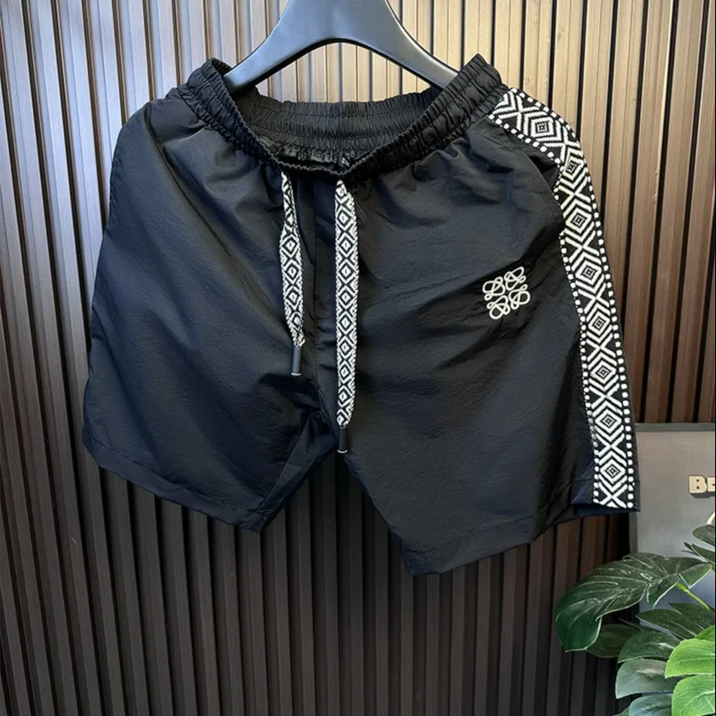 High-End Ribbon Stitching Sports Casual Men's Shorts Summer Thin Loose Ice Silk Quick-Drying Beach Pants Cropped Pants
High-End Ribbon Stitching Sports Casual Men's Shorts Summer Thin Loose Ice Silk Quick-Drying Beach Pants Cropped Pants