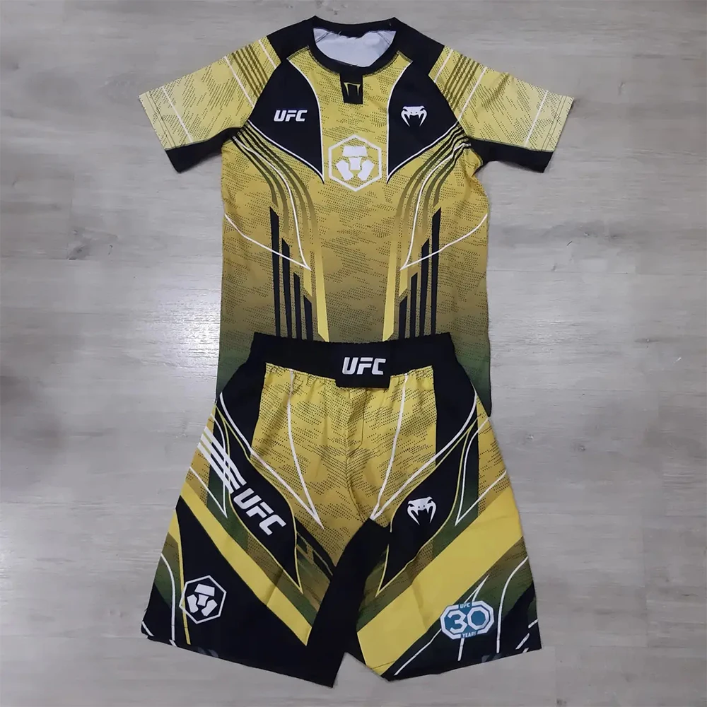 Новинка 2026 года, летний UFC ретро желтый боевой ночной боксерский комплект для мужчин, большой дышащий тренировочный комплект для быстрого сушки ММА, спортивный комплект дзюдзюцу
Новинка 2026 года, летний UFC ретро желтый боевой ночной боксерский комплект для мужчин, большой дышащий тренировочный комплект для быстрого сушки ММА, спортивный комплект дзюдзюцу