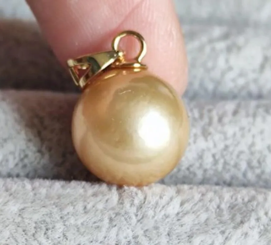 Stunning AAA+ 13-12mm natural south sea gold round pearl Pendants jewelry gold necklace sterling silver 925 chains
Stunning AAA+ 13-12mm natural south sea gold round pearl Pendants jewelry gold necklace sterling silver 925 chains