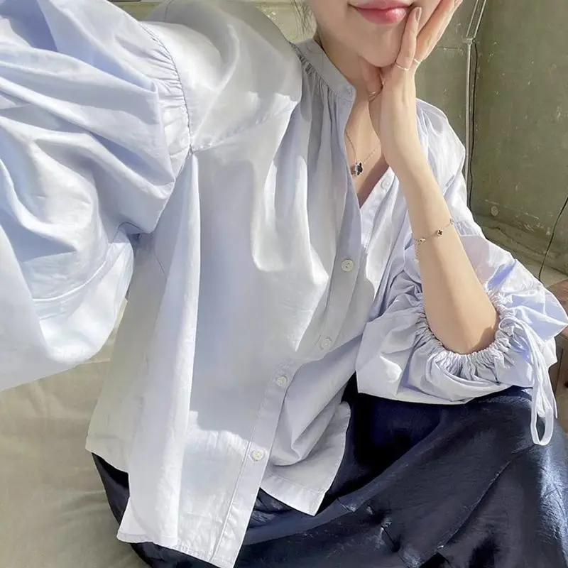 Autumn Niche Design Round Neck, Small Button, Tie, Loose And Versatile Lantern Sleeve Shirt For Women
Autumn Niche Design Round Neck, Small Button, Tie, Loose And Versatile Lantern Sleeve Shirt For Women