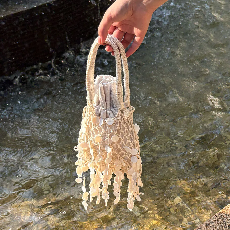 French retro casual pastoral cotton and linen crochet bag handbag fringed shell hollow bucket bag
French retro casual pastoral cotton and linen crochet bag handbag fringed shell hollow bucket bag