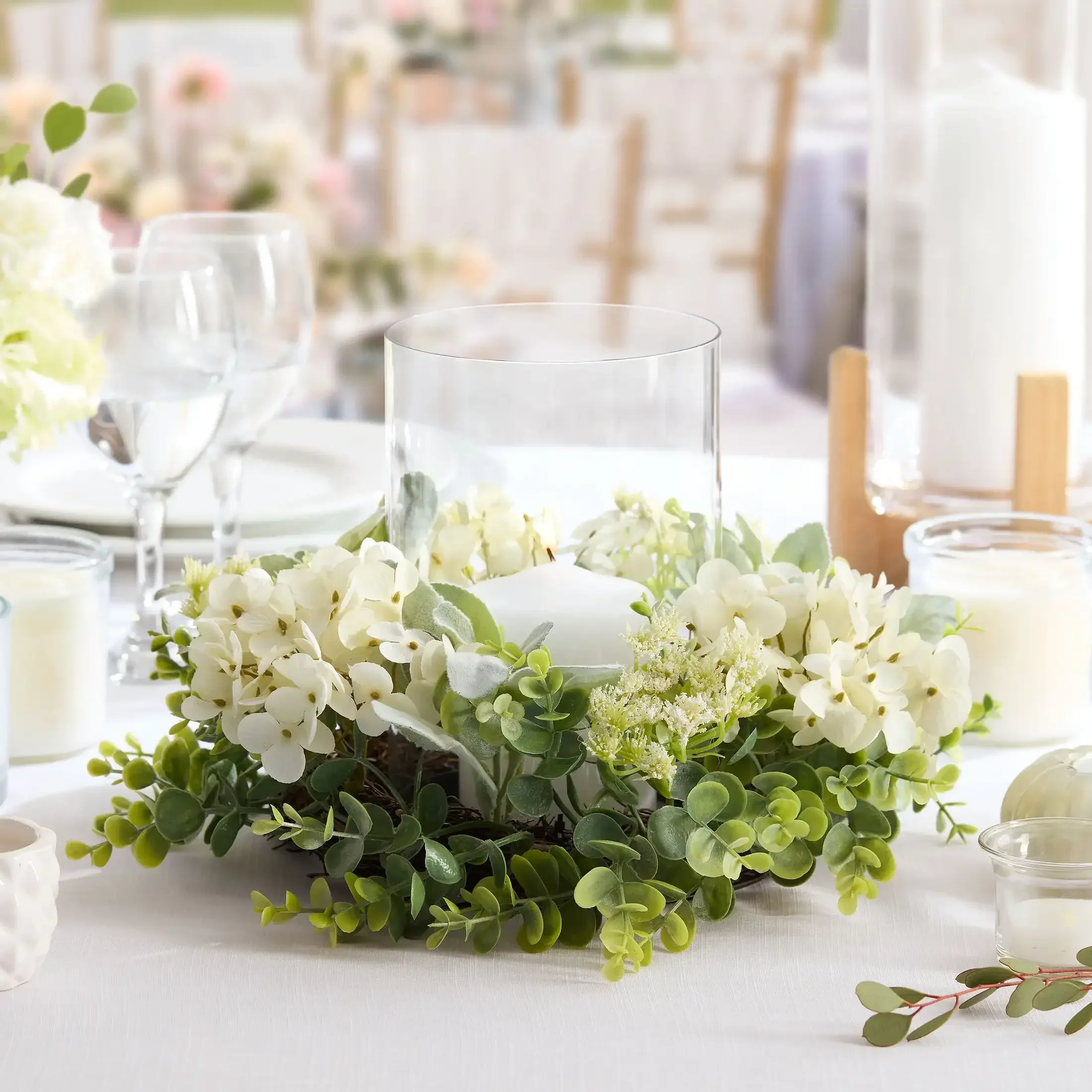 (Pack of 2) Decorative Hurricane Pillar Candle Holders with Faux White Hydrangea,11" x 11" x 8", Faux Flower Detail.
(Pack of 2) Decorative Hurricane Pillar Candle Holders with Faux White Hydrangea,11" x 11" x 8", Faux Flower Detail.