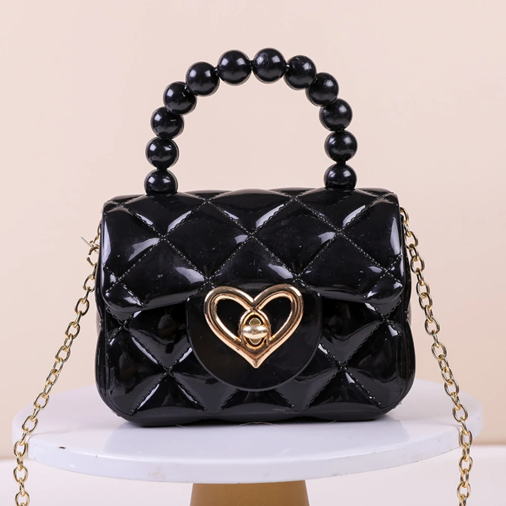 Новая сумка-желе, конфетных цветов, мини-сумка через плечо с цепочкой, жемчужной отделкой и ручкой, из желеобразного материала.
Новая сумка-желе, конфетных цветов, мини-сумка через плечо с цепочкой, жемчужной отделкой и ручкой, из желеобразного материала.