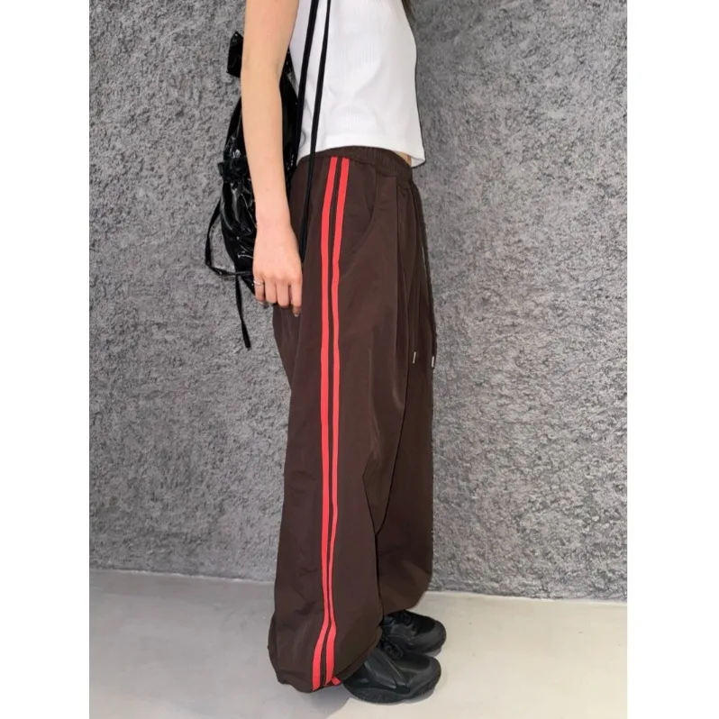 Retro Streetwear Nylon Sports Pants with Weave Straps Casual Loose Fit Neutral Style for Spring Autumn And Winter
Retro Streetwear Nylon Sports Pants with Weave Straps Casual Loose Fit Neutral Style for Spring Autumn And Winter