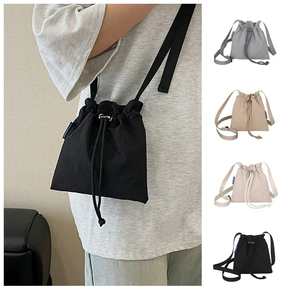 Casual Korean Style Drawstring Bucket Bag Crossbody Bag Quick-dry Nylon Shoulder Bag Purse Solid Color Mobile Phone Bag Men
Casual Korean Style Drawstring Bucket Bag Crossbody Bag Quick-dry Nylon Shoulder Bag Purse Solid Color Mobile Phone Bag Men