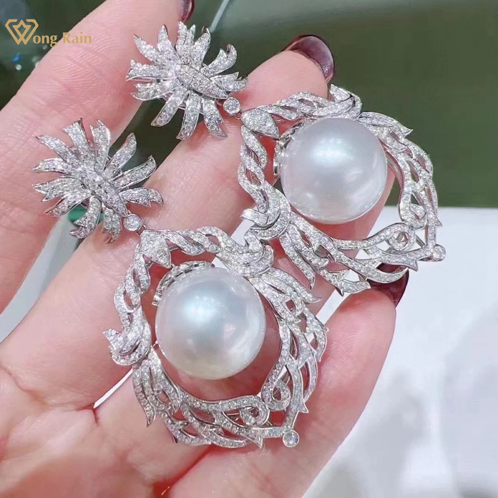 Wong Rain Luxury 925 Sterling Silver 10-12 MM Natural Pearl High Carbon Diamond Gems Sparkling Drop Earrings Customized Jewelry
Wong Rain Luxury 925 Sterling Silver 10-12 MM Natural Pearl High Carbon Diamond Gems Sparkling Drop Earrings Customized Jewelry