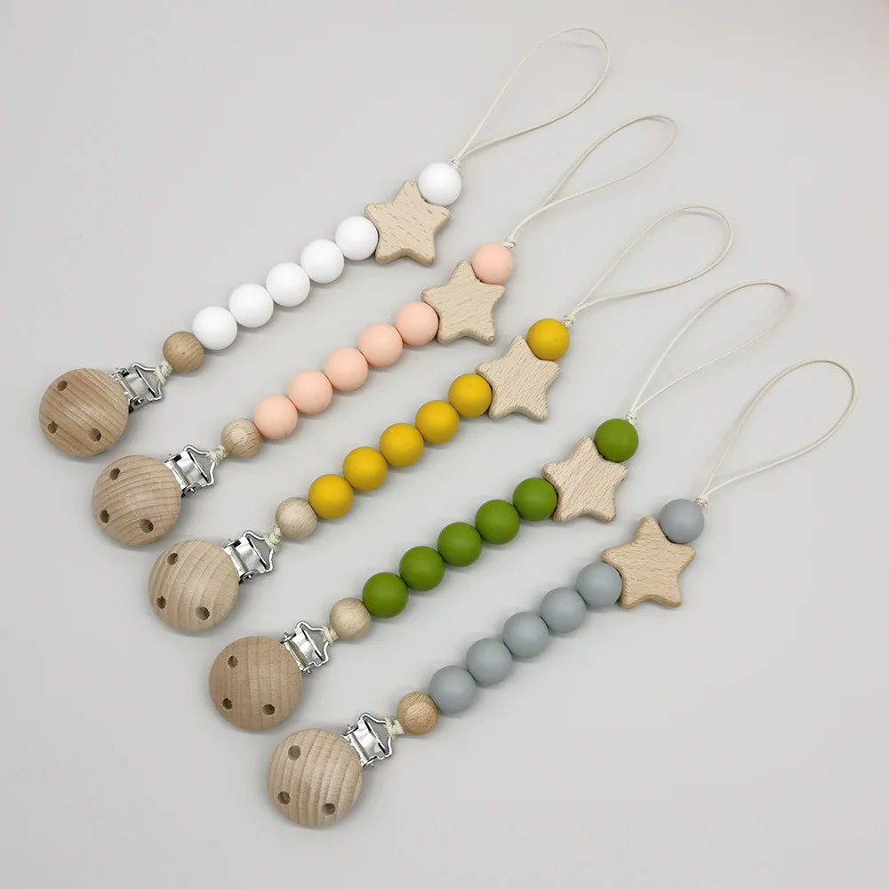 Dummy Clips Pacifier Holder Clips Star Soother Holder Baby Teether Toys Straps Nipple Holder Clips Wood Baby Pacifier Chain
Dummy Clips Pacifier Holder Clips Star Soother Holder Baby Teether Toys Straps Nipple Holder Clips Wood Baby Pacifier Chain