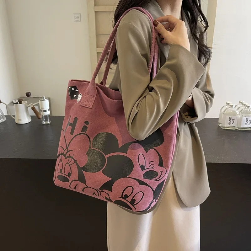 Miniso Mickey Minnie large capacity fashionable and versatile cute bag women's shoulder tote bag , a must-have for shopping.
Miniso Mickey Minnie large capacity fashionable and versatile cute bag women's shoulder tote bag , a must-have for shopping.
