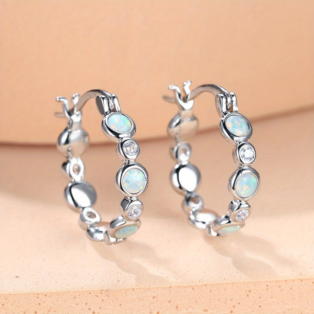 Женские серьги-кольца со сверкающим опалом, элегантные серьги серебряного цвета с цирконом, винтажные синие висячие серьги с цветочным принтом в подарок
Женские серьги-кольца со сверкающим опалом, элегантные серьги серебряного цвета с цирконом, винтажные синие висячие серьги с цветочным принтом в подарок