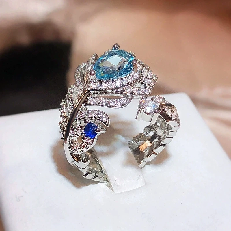 Live new blue zircon feather ring opening adjustable women's ring non-fading jewelry sapphire European and American style
Live new blue zircon feather ring opening adjustable women's ring non-fading jewelry sapphire European and American style