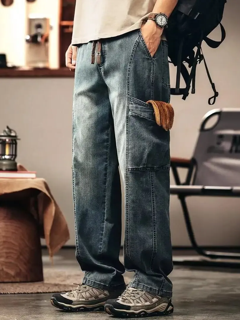 Американская рабочая одежда в стиле ретро, повседневные джинсы с эластичной резинкой на талии, мужские новые винтажные прямые длинные брюки с несколькими карманами
Американская рабочая одежда в стиле ретро, повседневные джинсы с эластичной резинкой на талии, мужские новые винтажные прямые длинные брюки с несколькими карманами