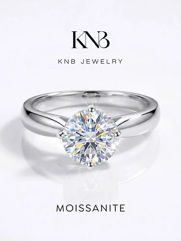 KNB 925, серебро 925 пробы, модные роскошные обручальные кольца с круглым бриллиантом из настоящего муассанита 1 карат для женщин, изысканные ювелирные изделия для свадьбы
KNB 925, серебро 925 пробы, модные роскошные обручальные кольца с круглым бриллиантом из настоящего муассанита 1 карат для женщин, изысканные ювелирные изделия для свадьбы