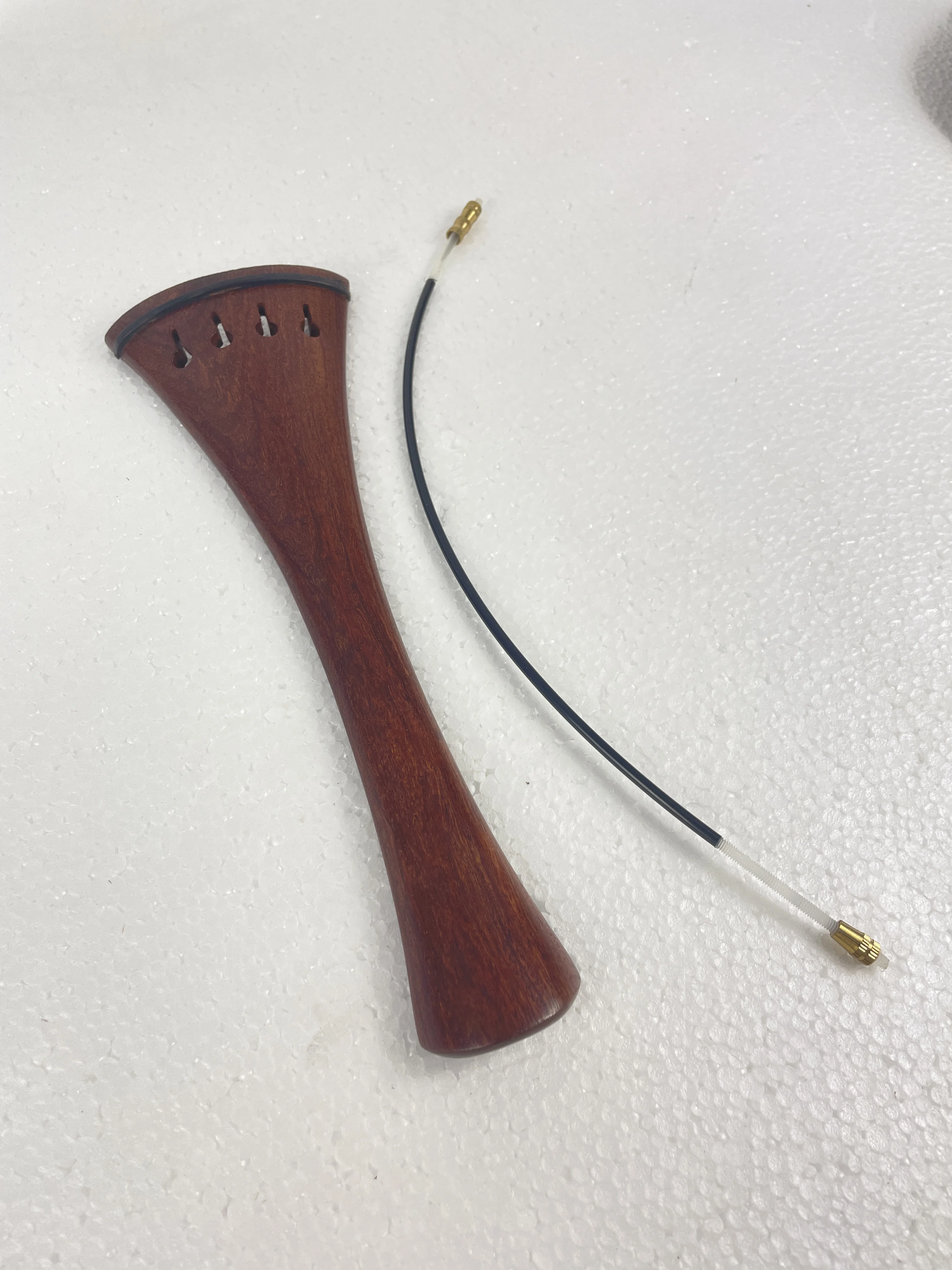 Four Fine Adjusters for the Tail piece of the cello. Red Wood cello The Tail Piece of the cello is provided with a Tail Rope
Four Fine Adjusters for the Tail piece of the cello. Red Wood cello The Tail Piece of the cello is provided with a Tail Rope