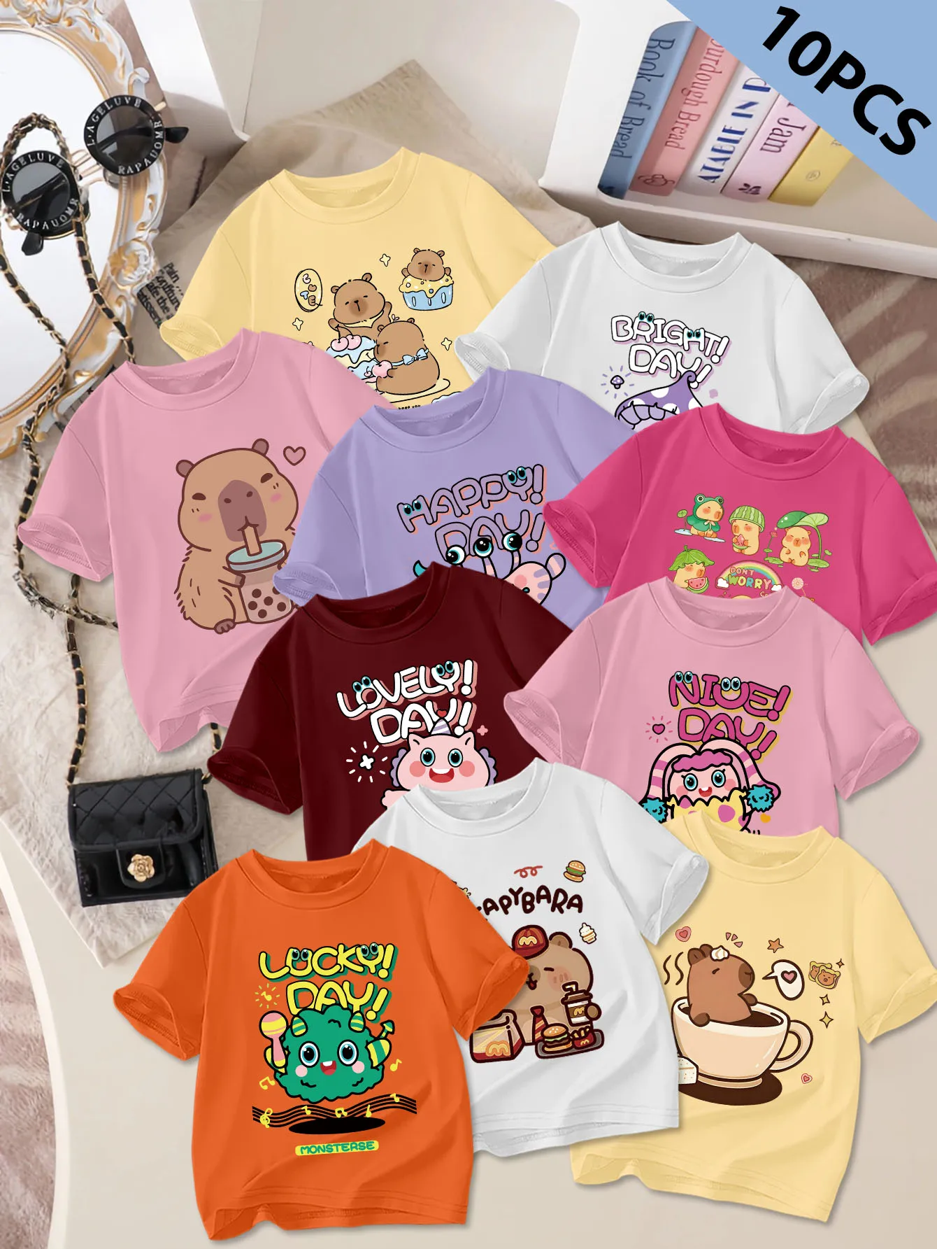 10 шт.: летняя милая и милая футболка с короткими рукавами для девочек, принтом с рисунком капибары и маленького монстра.
10 шт.: летняя милая и милая футболка с короткими рукавами для девочек, принтом с рисунком капибары и маленького монстра.