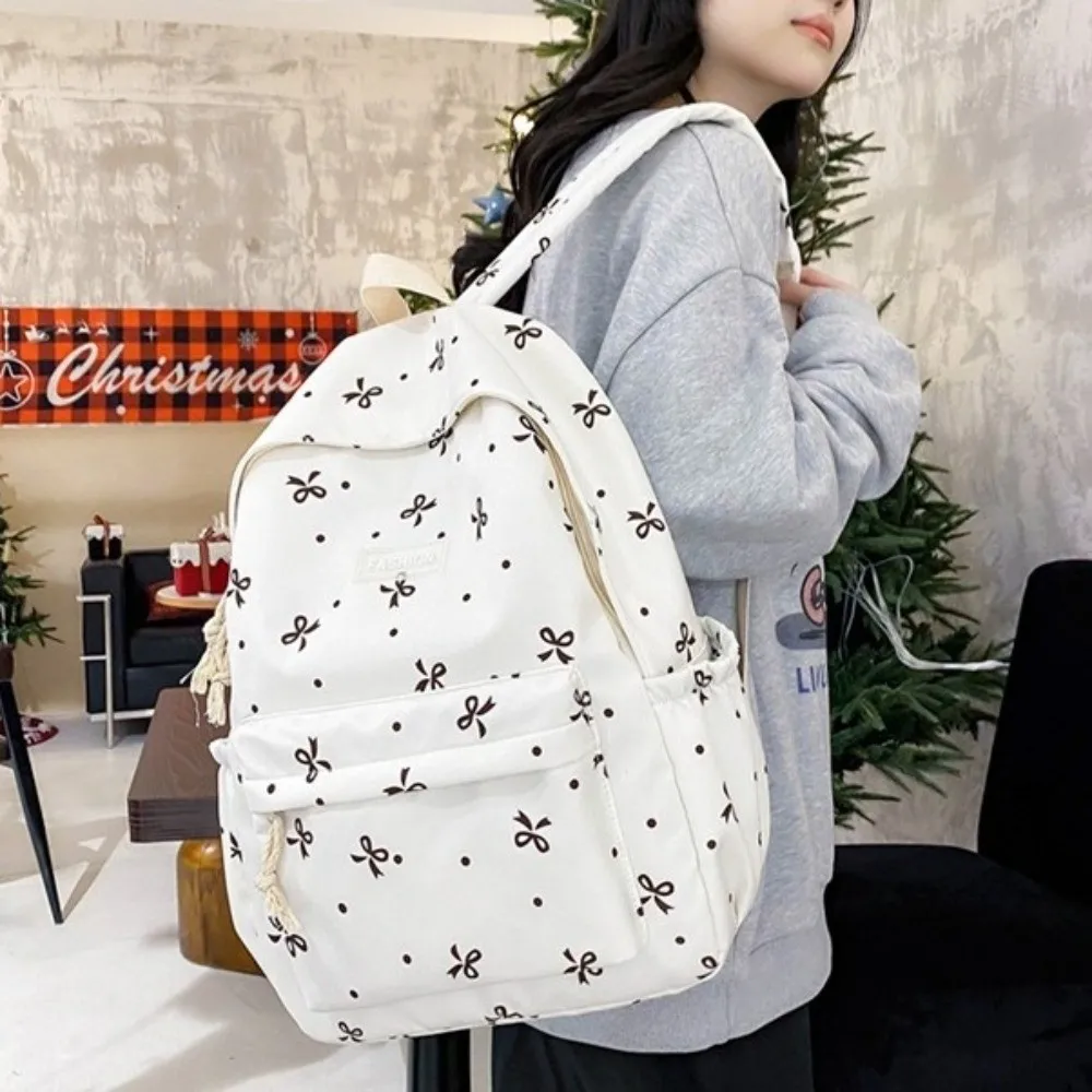 Nylon Material Bow Print Backpack Adjustable Straps Multi-Pocket Large Capacity School Bag Reinforce Structure Quilted Design
Nylon Material Bow Print Backpack Adjustable Straps Multi-Pocket Large Capacity School Bag Reinforce Structure Quilted Design