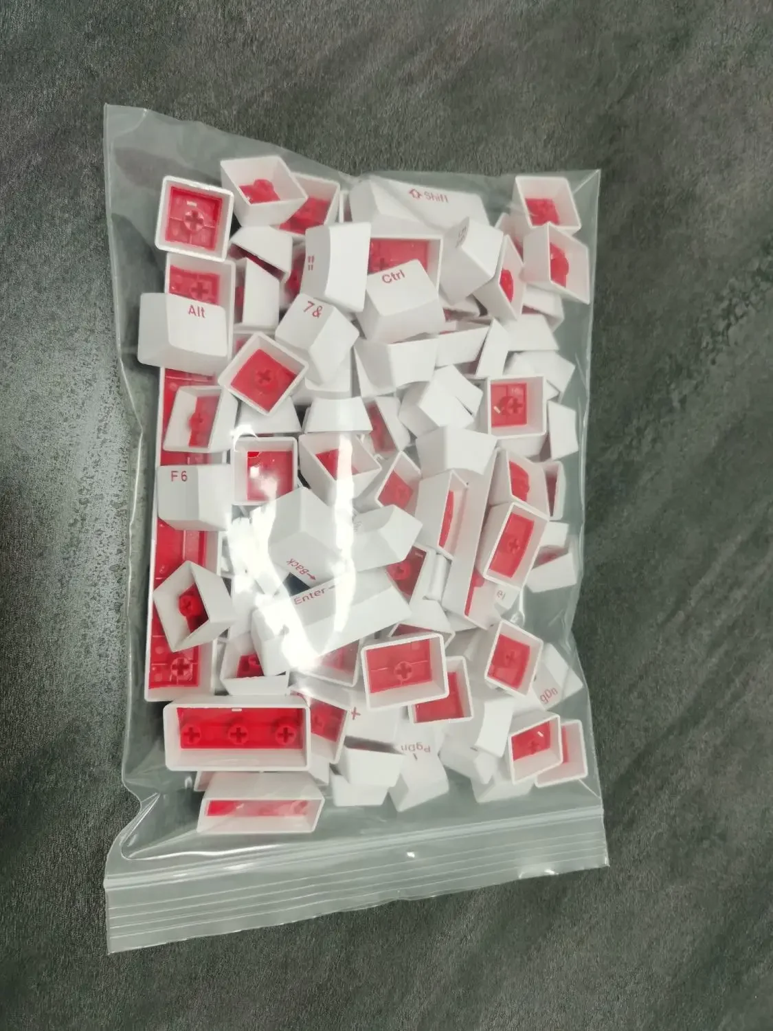Mechanical keyboard keycap OEM height PBT white background red letter light transmission two-color keycap clearance 87/98/104/61
Mechanical keyboard keycap OEM height PBT white background red letter light transmission two-color keycap clearance 87/98/104/61