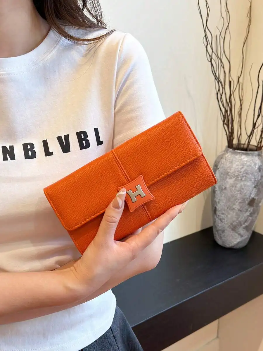 Orange Faux Leather Clutch Wallet With H Logo Closure
Orange Faux Leather Clutch Wallet With H Logo Closure