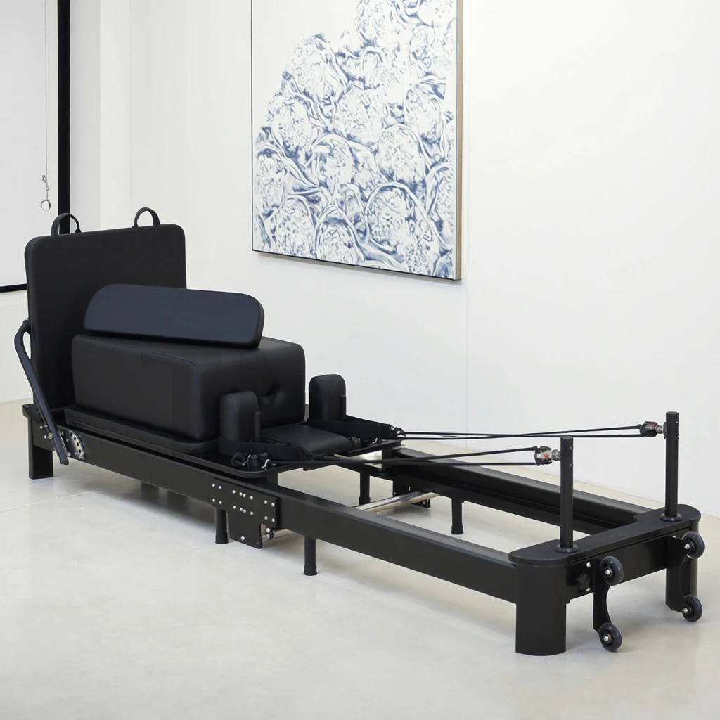 Portable and Adjustable Foldable Aluminium Alloy Pilates Reformer for Body Fitness at Home Black Folding Reformers by Factory
Portable and Adjustable Foldable Aluminium Alloy Pilates Reformer for Body Fitness at Home Black Folding Reformers by Factory