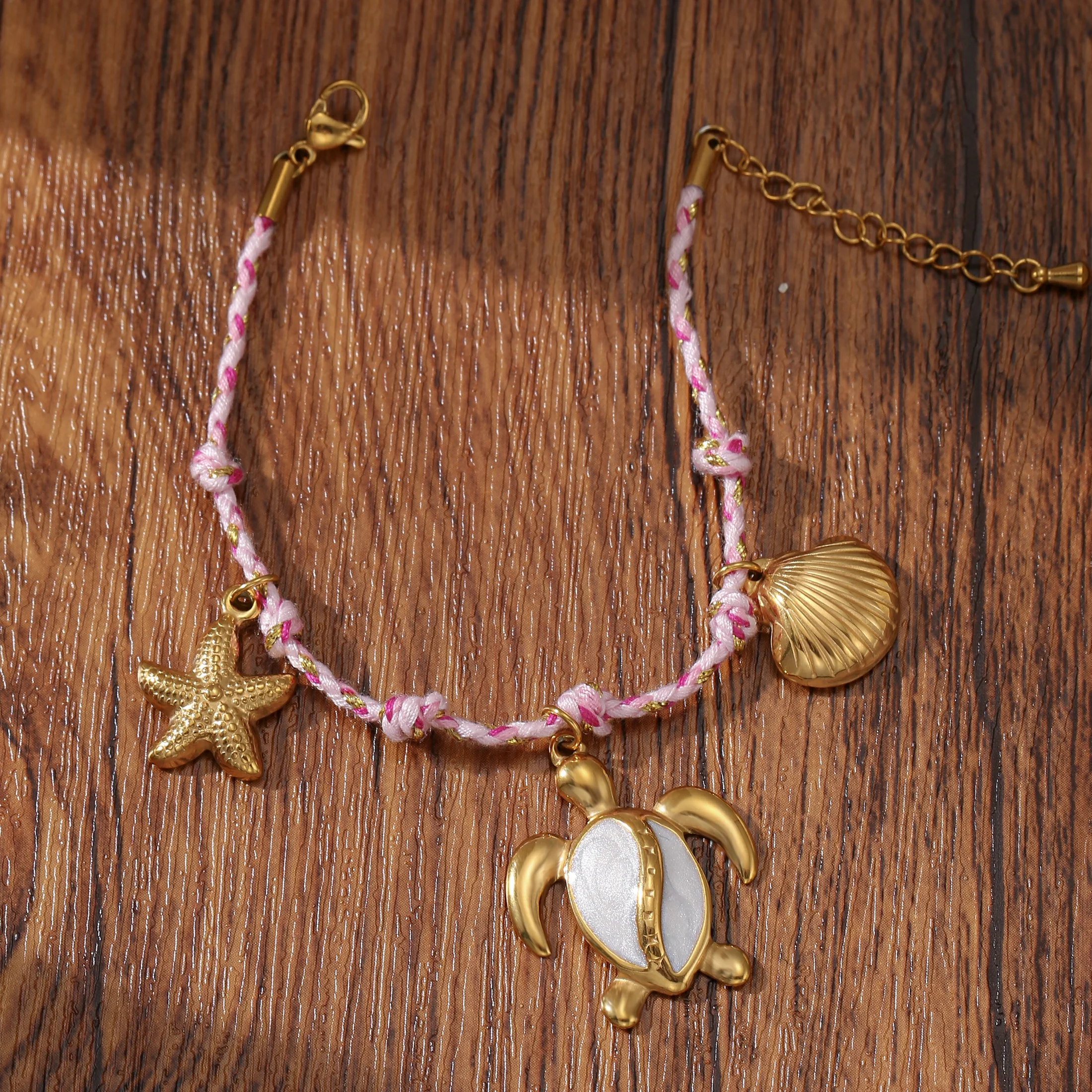 Golden Tone Braided Cord Ocean Charm Bracelet with Turtle and Starfish Pendants for Women
Golden Tone Braided Cord Ocean Charm Bracelet with Turtle and Starfish Pendants for Women