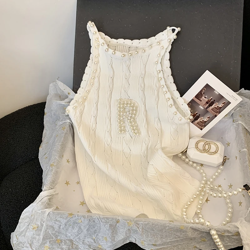 Heavy industry nail bead sleeveless knitted vest for women's summer new design slim fit and beautiful top 2025
Heavy industry nail bead sleeveless knitted vest for women's summer new design slim fit and beautiful top 2025