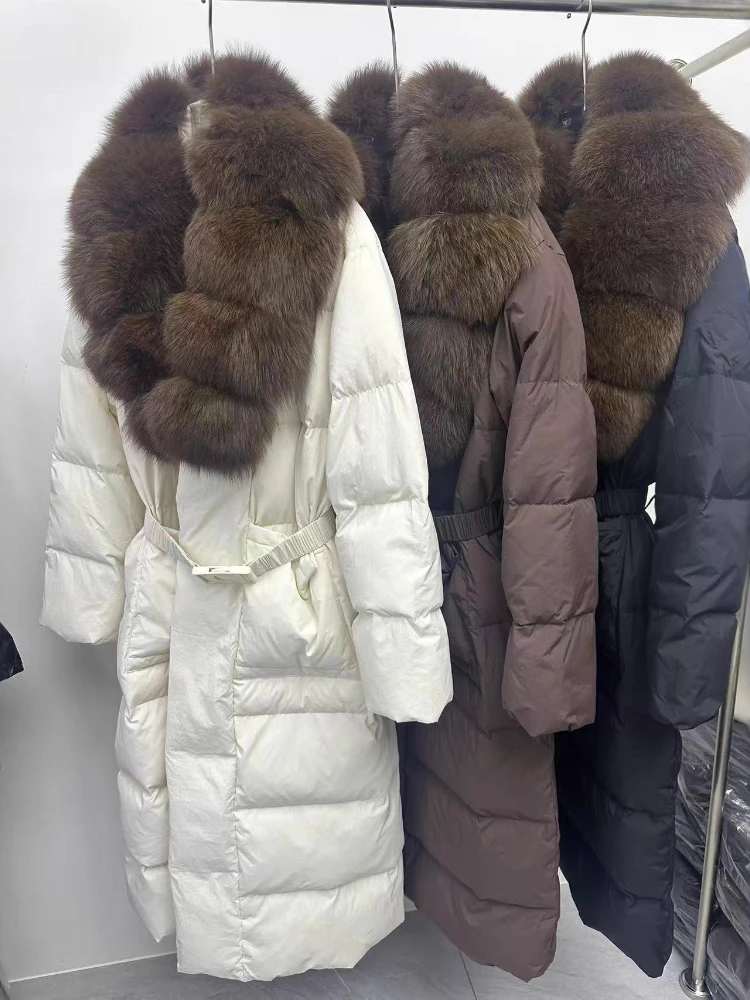 Super Long Down Jacket 2025 Winter New Big Fox Wool Collar Waist Women Parkas Elegant Thicken Warm Hooded White Duck Puffer Coat
Super Long Down Jacket 2025 Winter New Big Fox Wool Collar Waist Women Parkas Elegant Thicken Warm Hooded White Duck Puffer Coat
