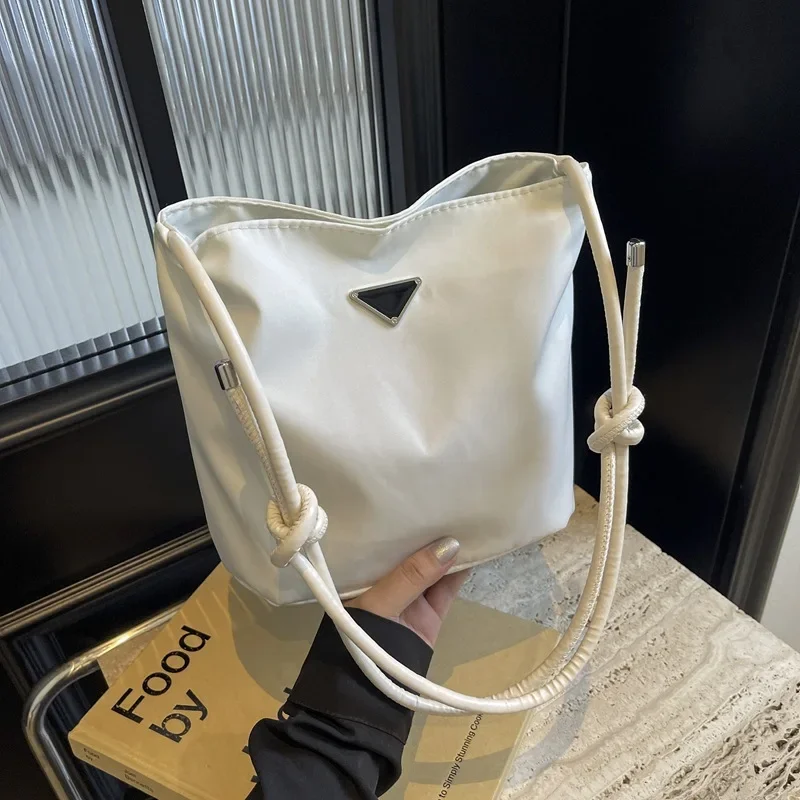 Triangle standard nylon cloth bag large capacity casual shoulder crossbody bucket bag
Triangle standard nylon cloth bag large capacity casual shoulder crossbody bucket bag