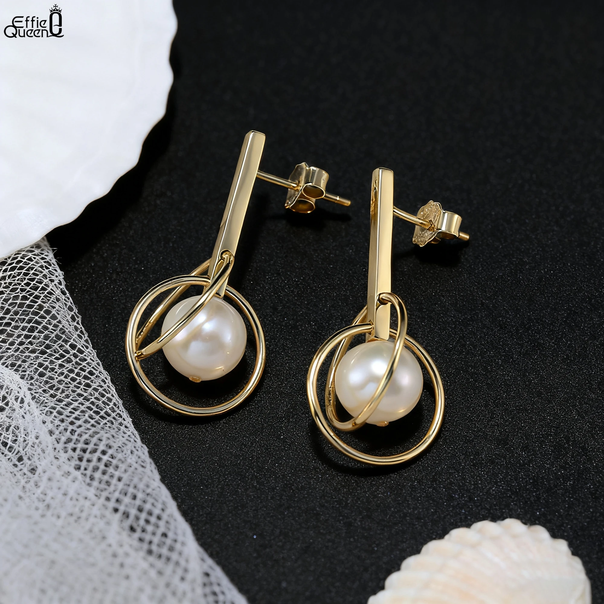 Effie Queen, серьги из 100% серебра 925 пробы с жемчугом, золото 14 карат, двойное кольцо, дизайн, аксессуары для ушей, ювелирные изделия, женские серьги, прекрасный подарок GPE93
Effie Queen, серьги из 100% серебра 925 пробы с жемчугом, золото 14 карат, двойное кольцо, дизайн, аксессуары для ушей, ювелирные изделия, женские серьги, прекрасный подарок GPE93