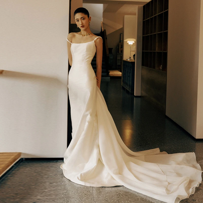 Корейское атласное свадебное платье 2024 года: простое, элегантное, с драпированной юбкой-русалкой для свадьбы и вечерних мероприятий
Корейское атласное свадебное платье 2024 года: простое, элегантное, с драпированной юбкой-русалкой для свадьбы и вечерних мероприятий