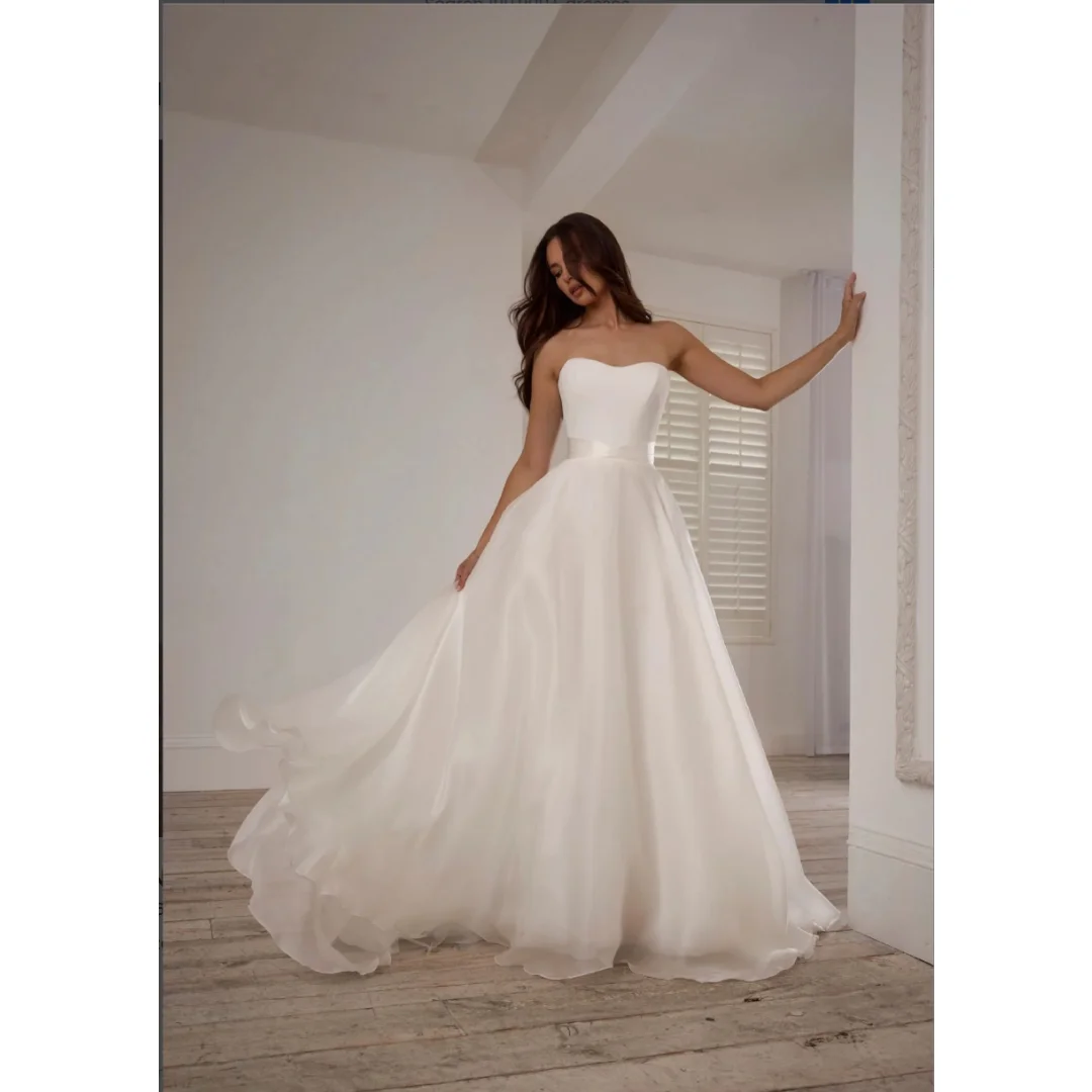 Custom Strapless Sweetheart A Line Wedding Dress Satin Waistband Low Back Button Flowy Organza Bridal Gown With Sweep Train
Custom Strapless Sweetheart A Line Wedding Dress Satin Waistband Low Back Button Flowy Organza Bridal Gown With Sweep Train