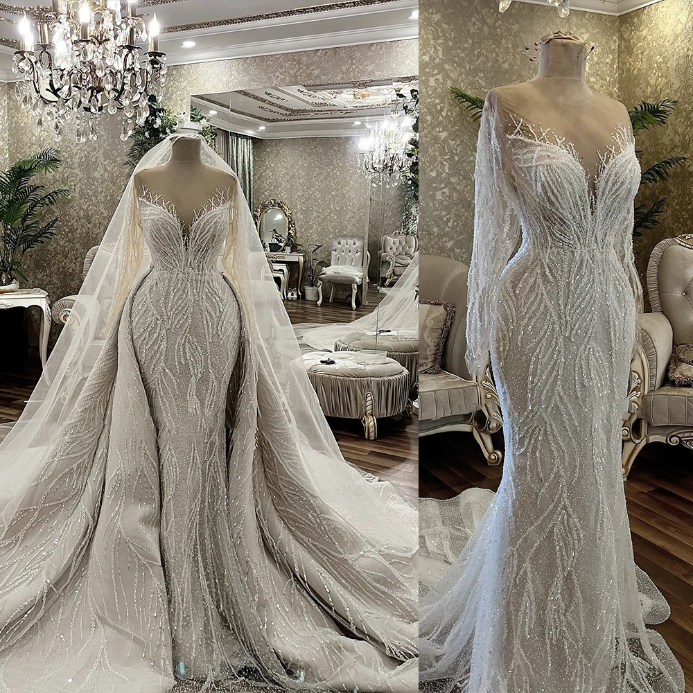 Customized Wedding Dress Vestidos Sheath Sheer Neck Shinny Beads Crystals Long Sleeves Church Bridal Gowns with Detachable Train
Customized Wedding Dress Vestidos Sheath Sheer Neck Shinny Beads Crystals Long Sleeves Church Bridal Gowns with Detachable Train