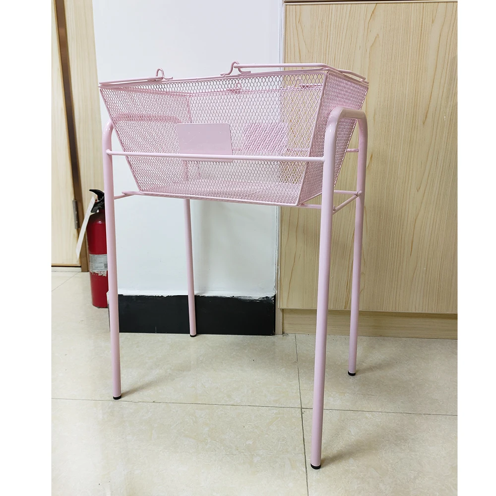 A set of 10 shopping baskets with 1 retail store supermarket stand, supporting a pink mesh metal basket base 
A set of 10 shopping baskets with 1 retail store supermarket stand, supporting a pink mesh metal basket base