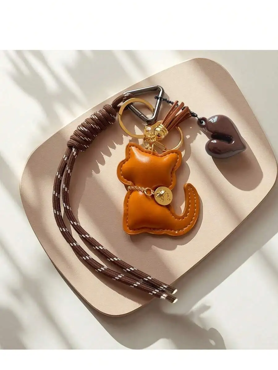 PU Leather Cat Keychain With Heart Charm And Tassel, Triangle Spring Clasp For Handbags Backpacks Car Keys
PU Leather Cat Keychain With Heart Charm And Tassel, Triangle Spring Clasp For Handbags Backpacks Car Keys