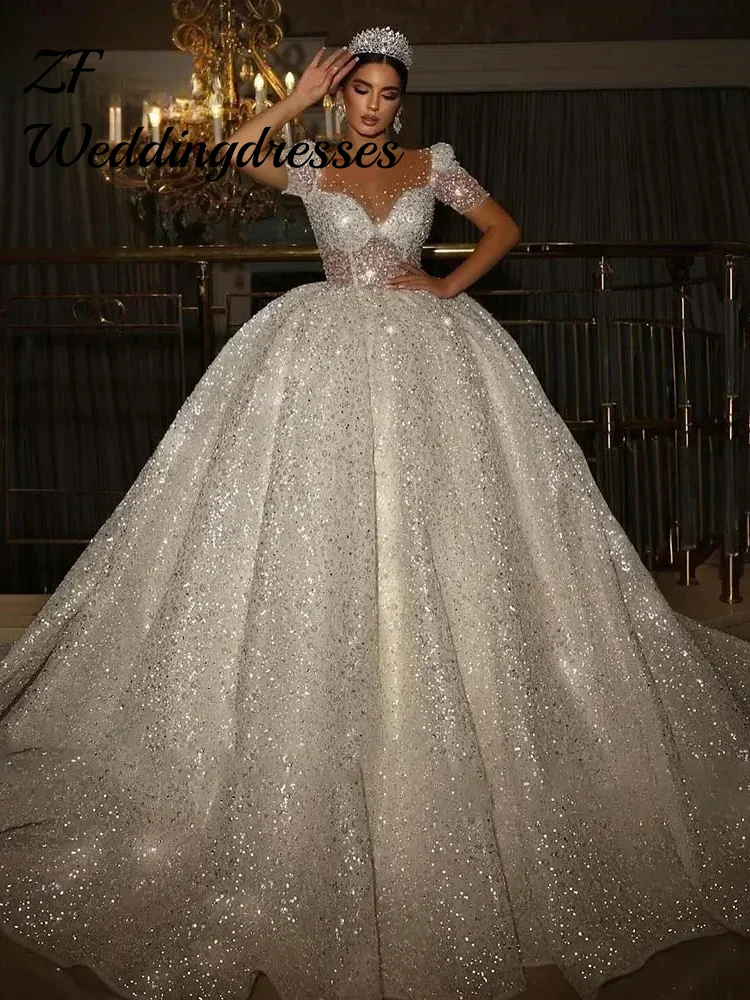 Customized Luxury Sheer O-neck Wedding Dress Sparkly Short Sleeves Corset Dubai A-line Princess Bridal Gown Vestido De Novia
Customized Luxury Sheer O-neck Wedding Dress Sparkly Short Sleeves Corset Dubai A-line Princess Bridal Gown Vestido De Novia