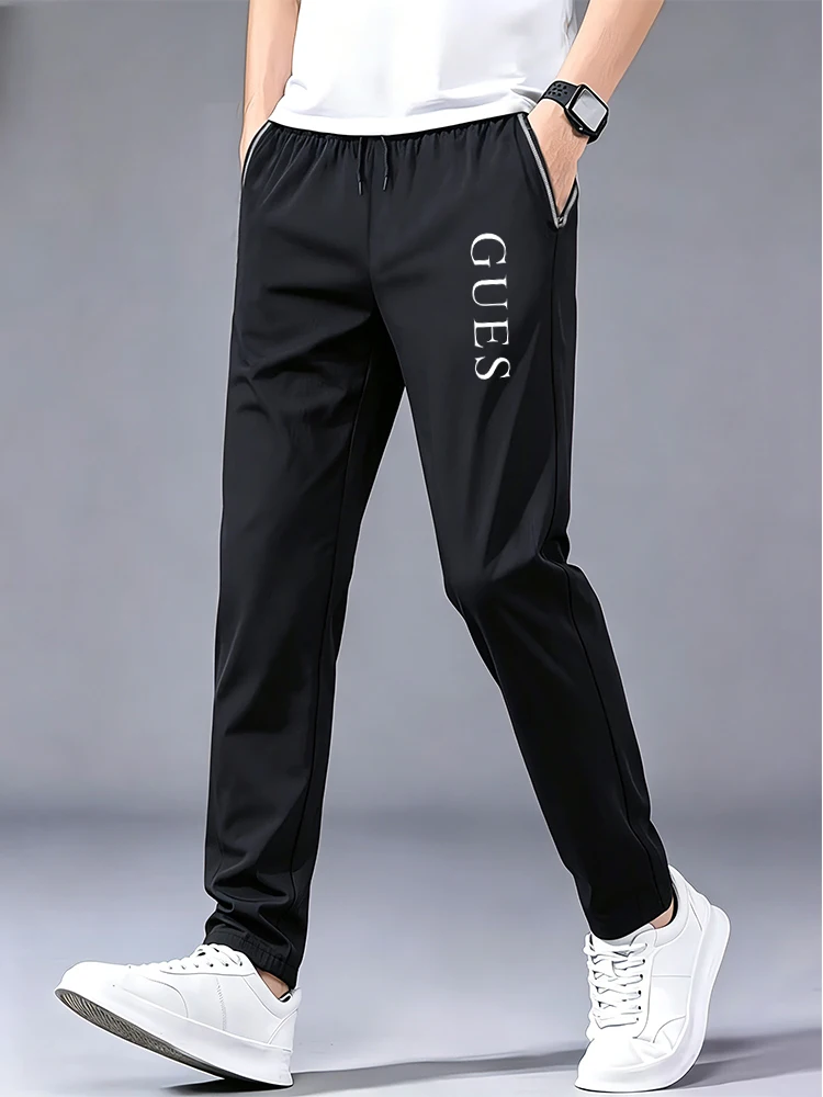 Men Vertical GUES Letter Print Ice Silk Jogger Pants Drawstring Elastic Waist Cuffed Ankle Quick Dry Sports Trousers Streetwear
Men Vertical GUES Letter Print Ice Silk Jogger Pants Drawstring Elastic Waist Cuffed Ankle Quick Dry Sports Trousers Streetwear
