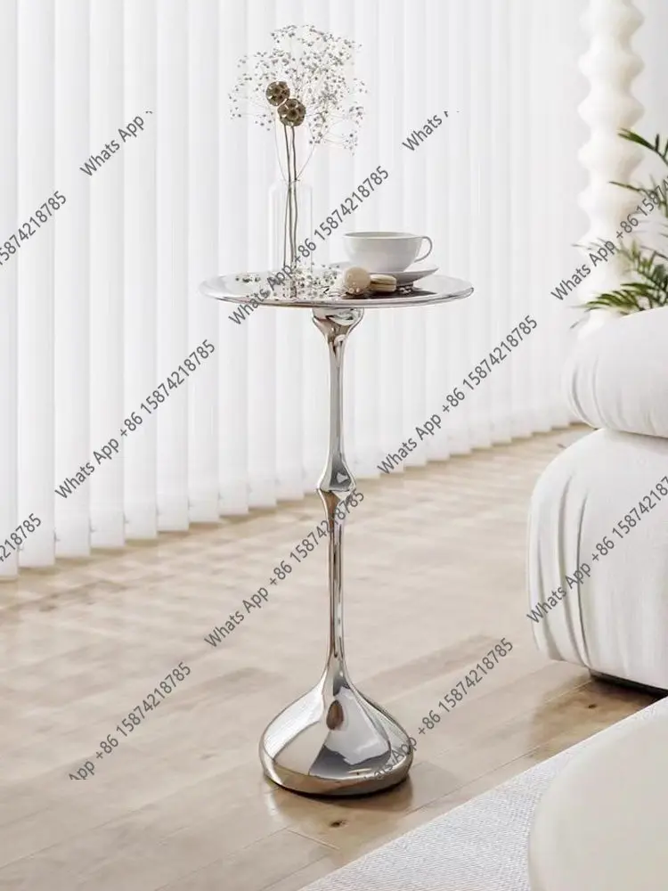 New Italian minimalist creative stainless steel mirror round small coffee table light luxury simple designer
New Italian minimalist creative stainless steel mirror round small coffee table light luxury simple designer
