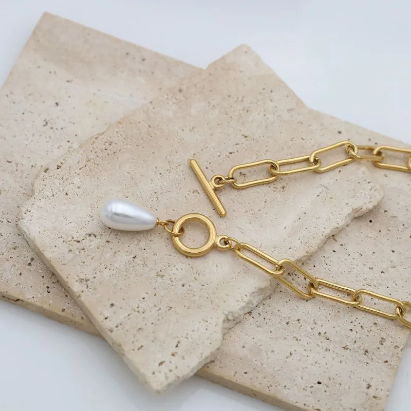 Модное элегантное колье с жемчужной подвеской и застежкой OT, женское, в стиле легкой роскоши, нишевое, геометрическое, на ключицу
Модное элегантное колье с жемчужной подвеской и застежкой OT, женское, в стиле легкой роскоши, нишевое, геометрическое, на ключицу