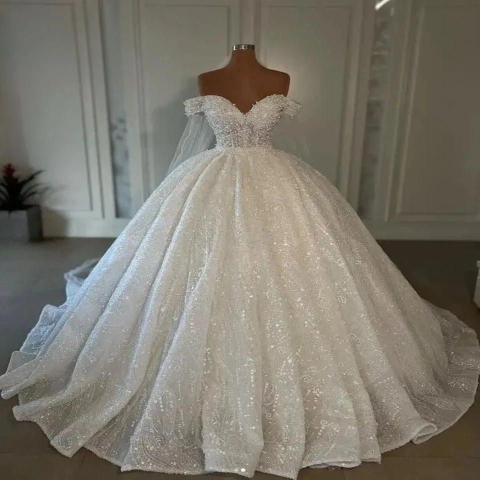 Customized Sweetheart Appliques Sequined Wedding Dress 2026 Court Train Tulle Off the Shoulder New Style Ball Gown Bridal Gowns
Customized Sweetheart Appliques Sequined Wedding Dress 2026 Court Train Tulle Off the Shoulder New Style Ball Gown Bridal Gowns